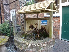 Photograph: The well at the Greyhound Coaching Inn in Lutterworth. Click to view an enlargement.